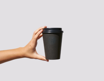 hand holding a coffee cup