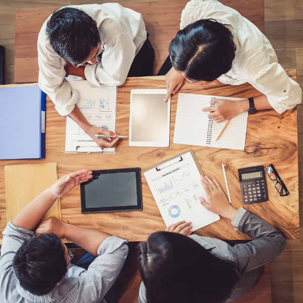 a group of people conducting a business meeting