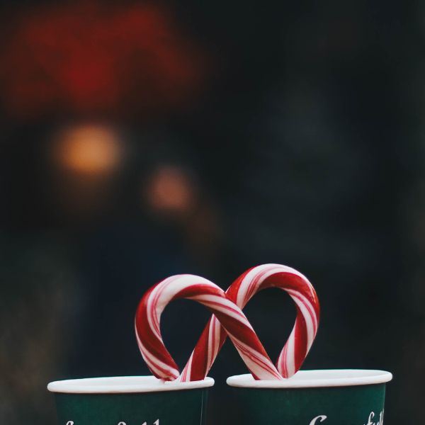candy cane inside coffee cups