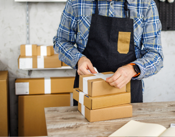 man packaging a box