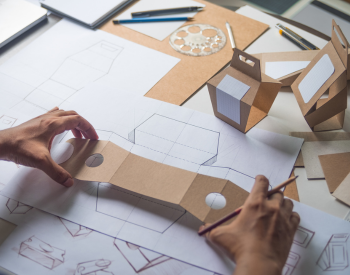 a man working on a packaging design